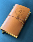 Handmade leather journal with engraved floral initials monogram design
