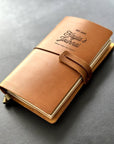 Handmade refillable leather journal with engraved motivational quote design