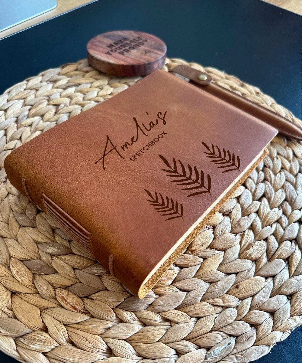 Personalised leather sketchbook engraved with leaf design and custom name
