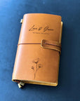 Floral engraved leather journal, custom-designed for her. Ideal for writers, couples, and professionals seeking a personalized and thoughtful gift