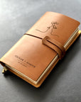 Personalised leather couple’s journal with engraved line art silhouette