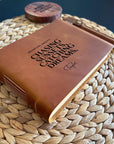 Handmade leather bound journal with custom engraving.