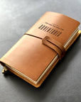 Handmade refillable leather adventure journal with engraved text