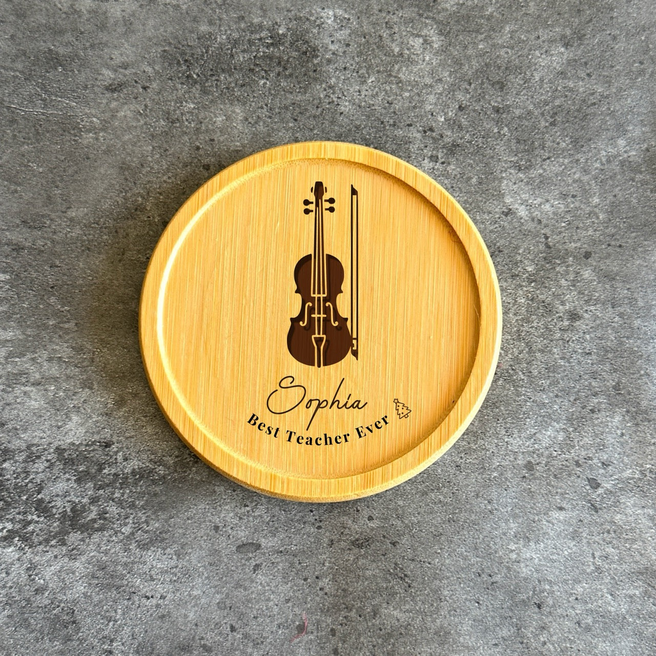 Engraved bamboo coaster with instrument design for music lovers
