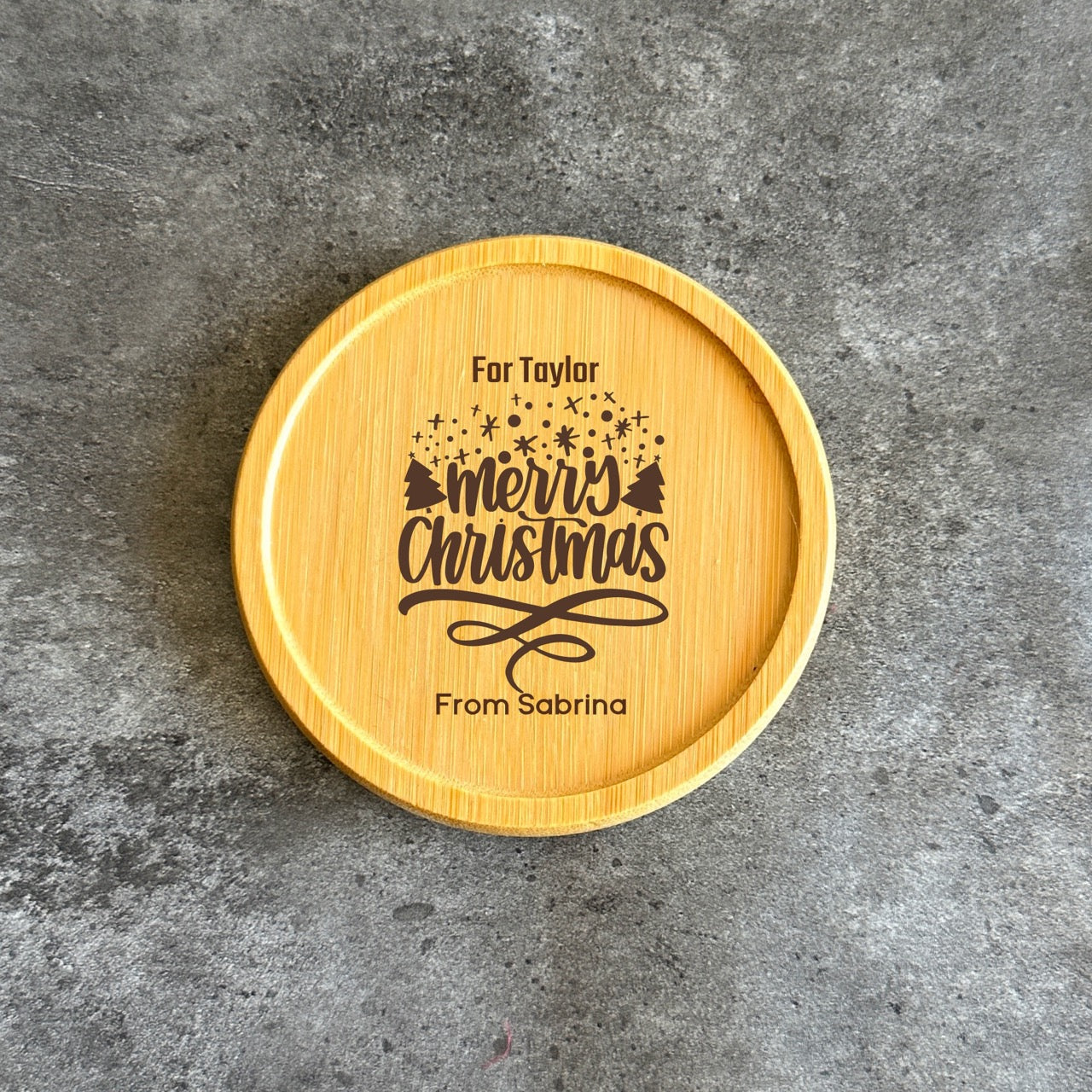 Engraved bamboo coaster with Merry Christmas design