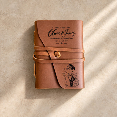 Personalised leather wrap journal engraved with a couple portrait, names and an Our Story text design.