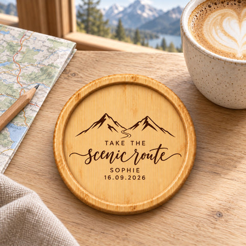 Wooden coaster engraved with the Take the Scenic Route mountain design