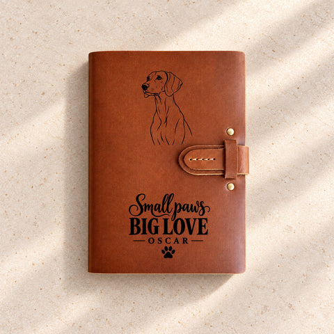 Thick leather notebook with an engraved dog portrait and personalised wording.