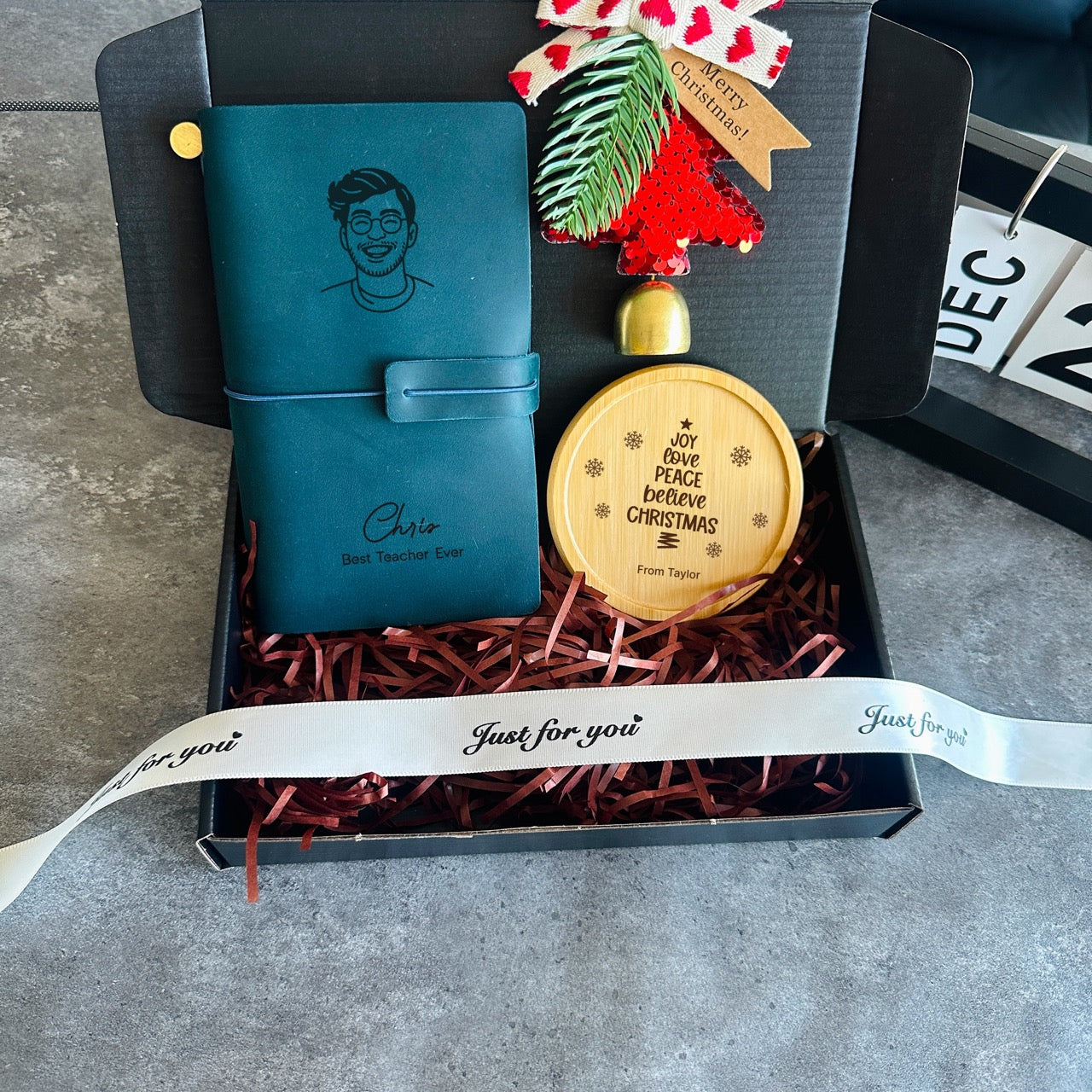 Festive personalised Christmas gift box with leather journal, engraved coaster and ornament