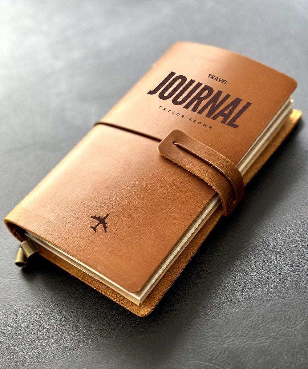 Handmade refillable leather travel journal with engraved airplane icon