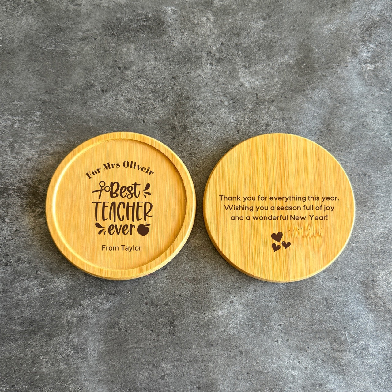 Two wooden coasters with personalized messages for a teacher.