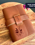 Personalised refillable leather journal with floral engraving and name strap
