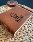 Handmade leather adventure journal with engraved hiking traveller design