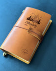 Rustic leather diary for men with name engraving and strap closure