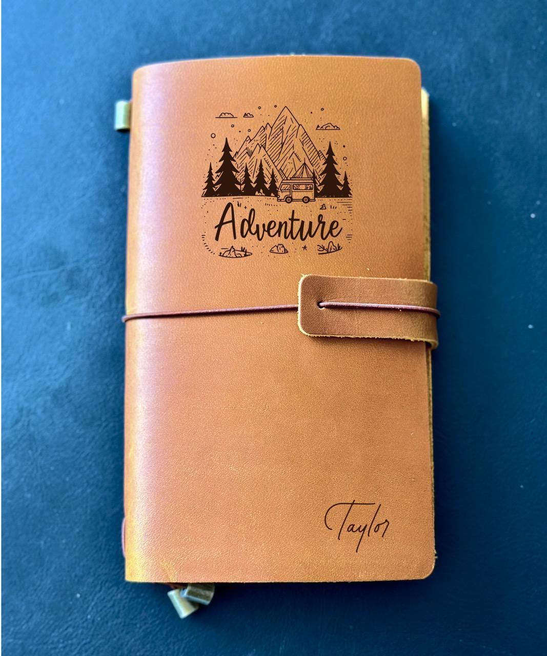 Custom leather travel notebook with adventure mountain design