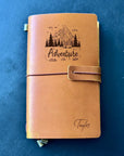 Custom leather travel notebook with adventure mountain design