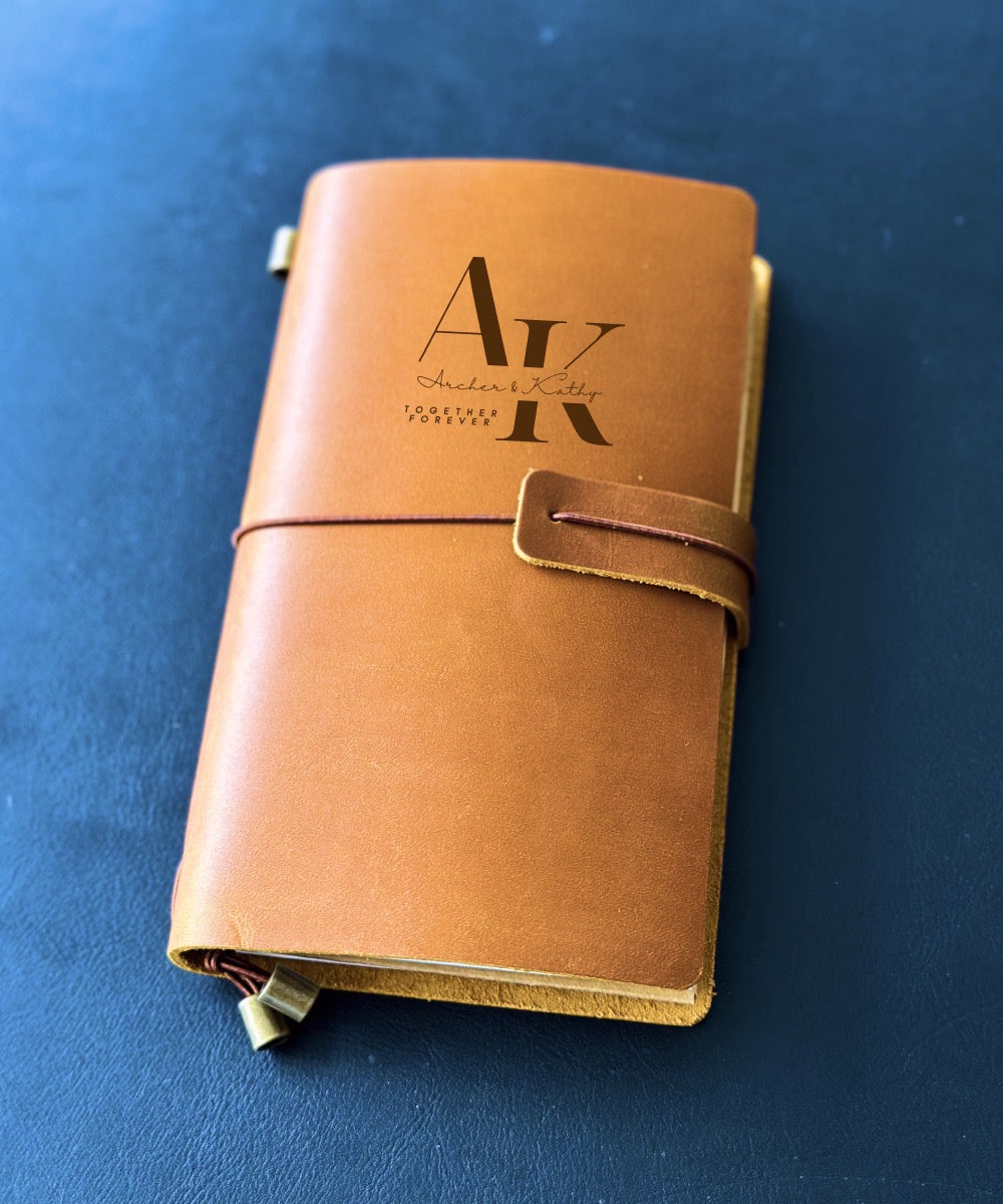 Leather journal with custom engraving, ideal for couples' celebrations.